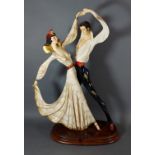 A Santini, Tango Dancers, hand painted figures upon wooden base, 50cm high