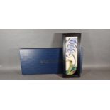 A Moorcroft tube lined rectangular plaque, Fly Away Home pattern, 30.5cms x 9.5cms with original box