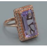 D Joy, A dress ring set with a large Amethyst, elongated octagon cut, ring size S