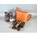 A Pair of Binoculars by Negretti & Zambra within leather case together with a pair of German