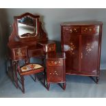 An early 20th Century French mahogany and painted bedroom suite, comprising dressing table with