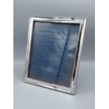 A Birmingham silver rectangular photograph frame, 30cms x 24.5cms