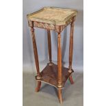 A French jardiniere stand, the marble top with brass gallery above reeded supports with undertier,