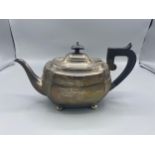 A Birmingham silver teapot of shaped form, with ebonised handle, 16ozs all in