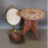 An African carved hardwood bowl together with a folding table and a brass mirror frame