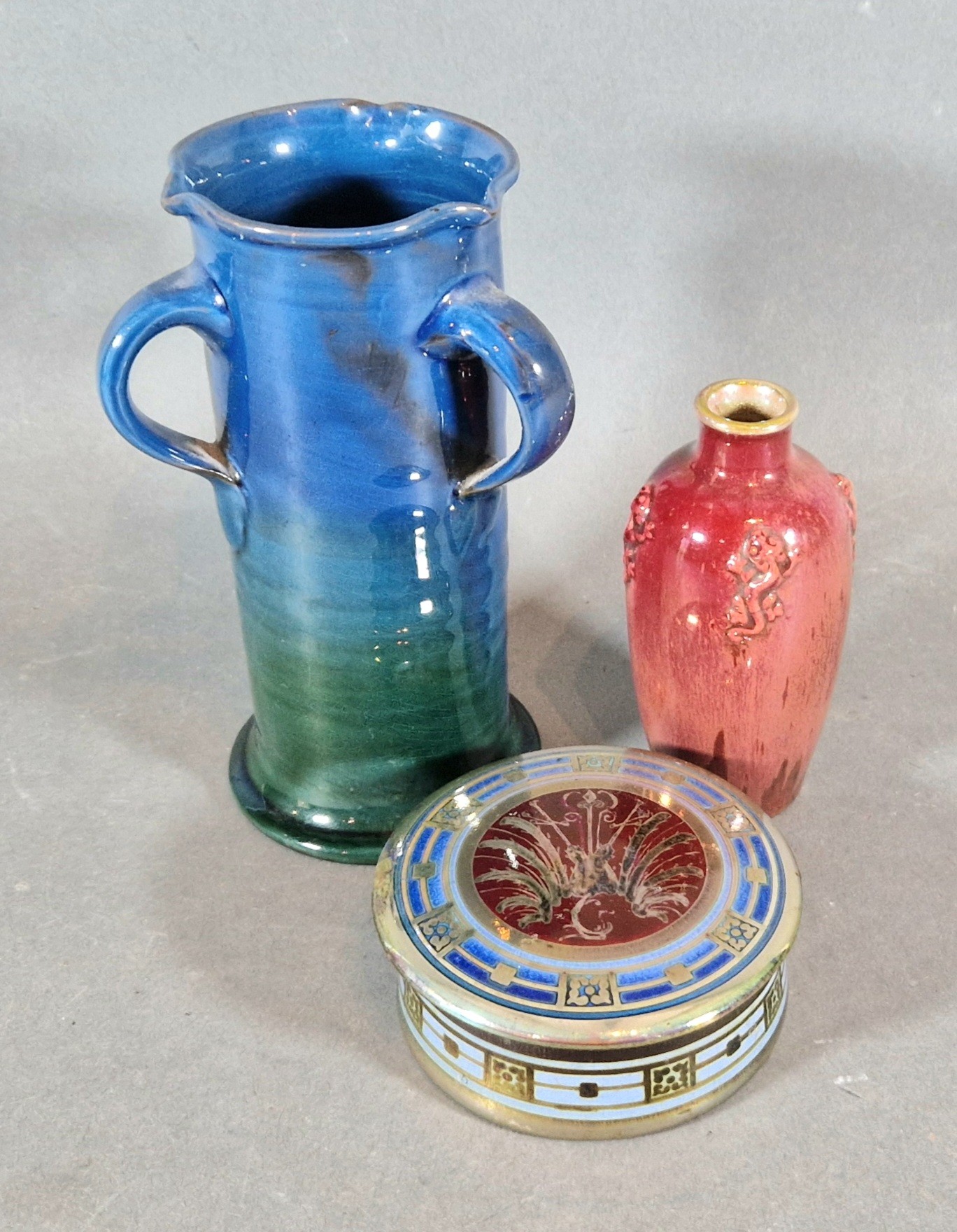 A Pilkington Royal Lancastrian small vase, 11cms tall together with a circular covered box and a