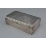 A Birmingham silver cigarette box, 16.5cms long