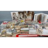 A large postcard collection withing albums and loose, to include Royalty, humorous and black and