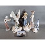 A Lladro porcelain model in the form of a bird together with six other Lladro porcelain models and a