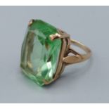 A Yellow Metal Dress Ring set large green stone, ring size L, 6.4g