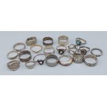 A collection of twenty silver dress rings