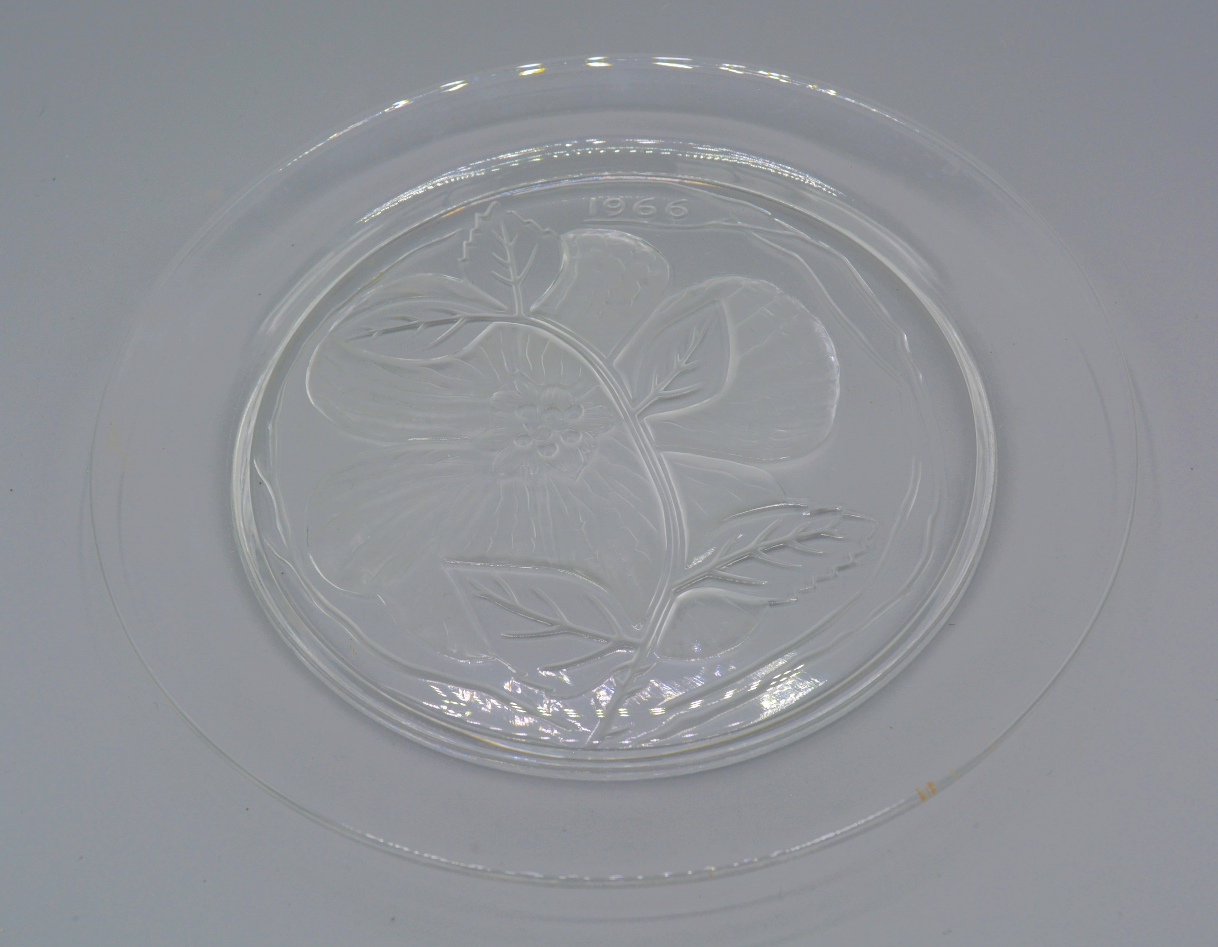 A Lalique glass annual plate, Dream Rose flower pattern, signed Lalique France, 21.5cms diameter