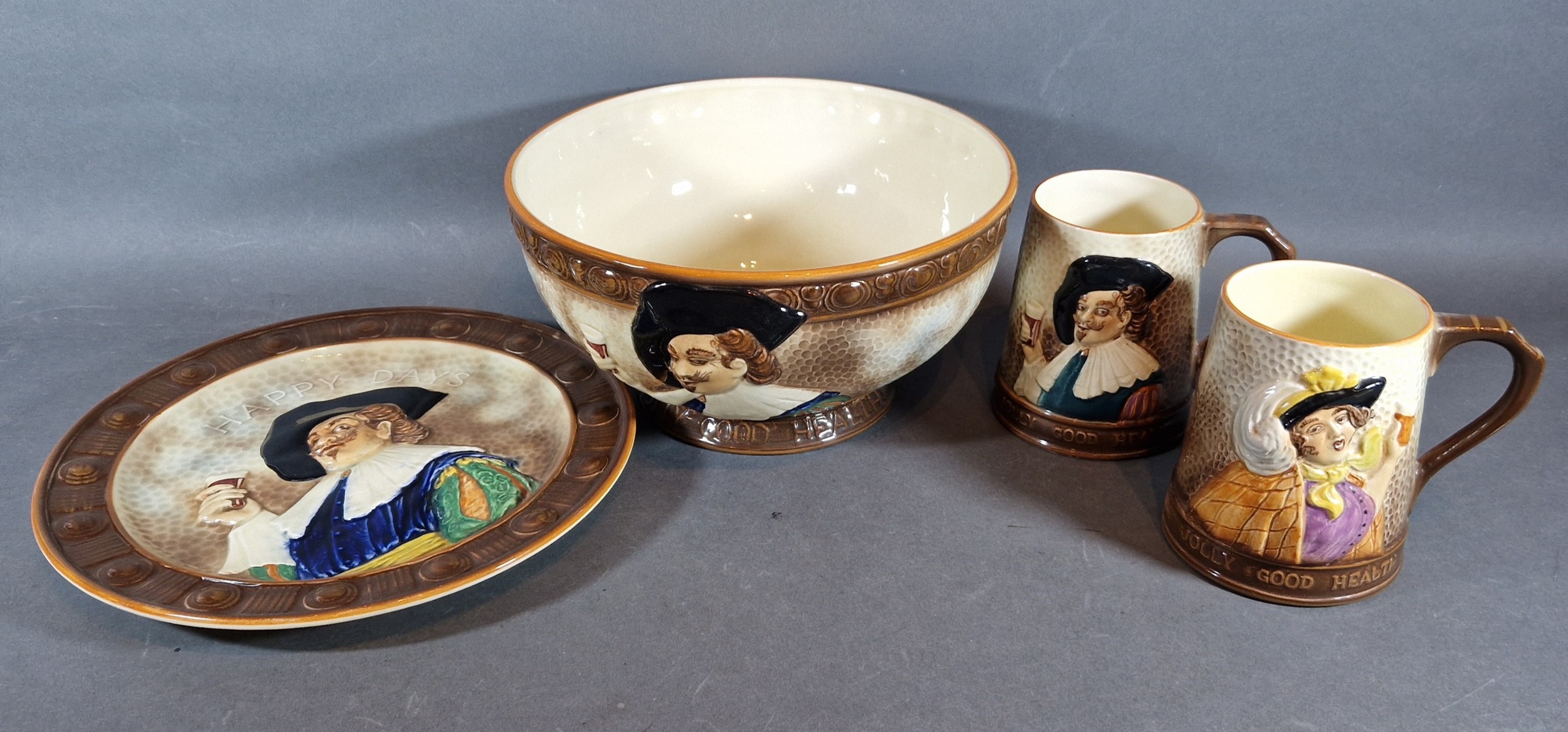 A Falcon Ware Cavalier pattern bowl together with a matching dish and pair of mugs