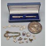 A London Silver Backed Mirror, together with a silver case pen and a collection of silver