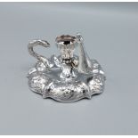 A Victorian silver chamber candlestick of shaped form, London 1840, makers mark CF