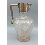 A George V cut glass and silver mounted Claret jug, Birmingham 1913 retailed by Mappin and Webb,
