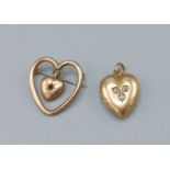 A 15ct gold locket in the form of a heart set three diamonds 4.2 grams all in together with a brooch