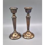 A pair of Birmingham silver candlesticks, 15cms tall