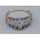 A 14ct gold ring set with two rows of graduated diamonds, 2.6 grams, ring size K