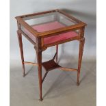 An Edwardian mahogany bijouterie with hinged top above carved cabriole legs with undertier, 46cms