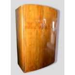 An Art Deco Walnut Bow Fronted Double Wardrobe, together with a matching smaller wardrobe with