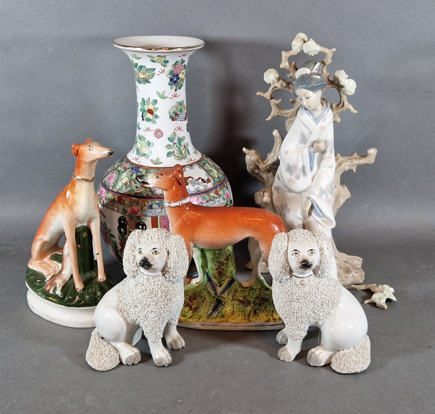 A pair of Staffordshire models of Spaniels together with two Staffordshire models of Greyhounds, a