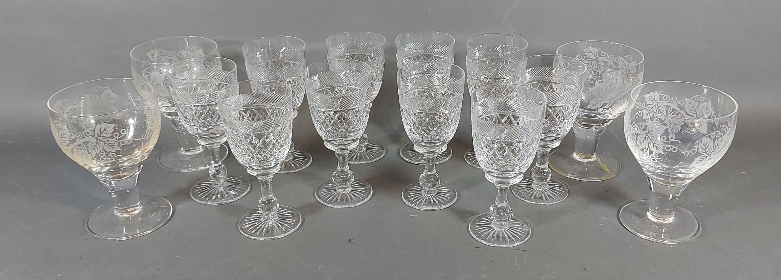 A collection of ten glasses by Tudor together with four rummers with grape vine decoration