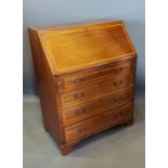 An Edwardian mahogany satinwood inlaid bureau, the fall front above four drawers with brass