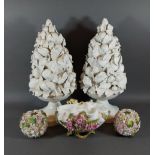 A pair of white glazed fruit mounted side pieces, together with a pair of foliate encrusted vases