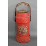 A canvas shell carrier, with a coat of arms on a red ground, 33cms tall