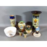 A Royal Doulton series ware vase, A Royal Doulton vase, A Royal Doulton figure, three Doulton