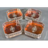 A set of four simulated Totoiseshell and silver plated bottle coasters, 12cms square