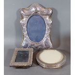 A London silver photograph frame together with two other silver photograph frames