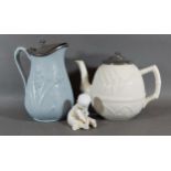 A Victorian salt glazed teapot together with a similar jug and a bisque figure