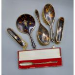 A Birmingham silver and tortoiseshell five piece dressing table set, comprising four brushes and a