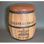 A Barrel form stool inscribed Chateauneuf Du Pape, with buttoned seat, 52cms tall