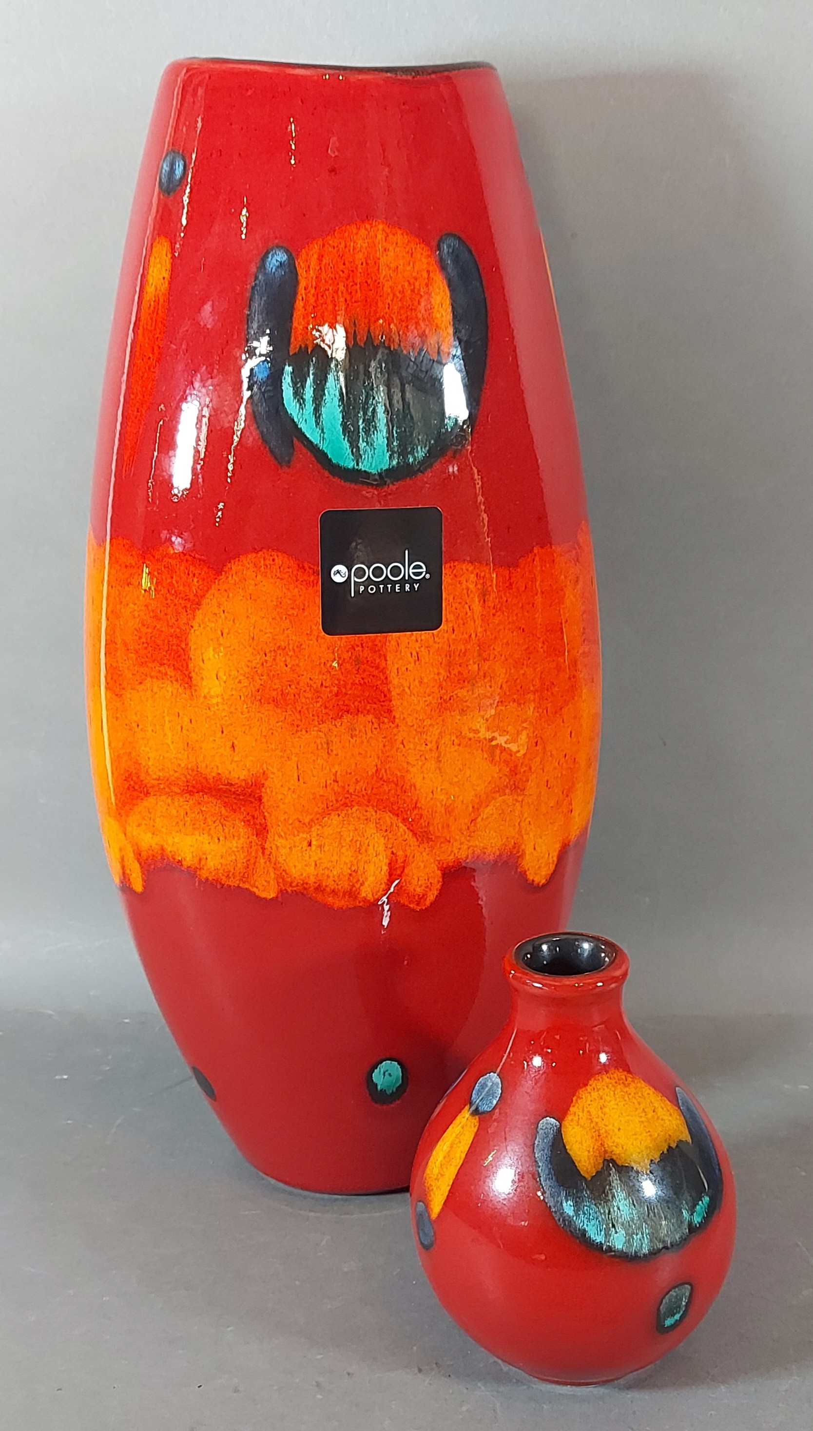 A Poole Pottery Manhattan vase with volcano glaze, 37cms tall, together with another similar smaller