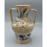 A Doulton Lambeth stoneware two handled vase by Arthur Barlow, with incised scrolls upon a blue