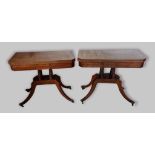 A pair of Regency mahogany card tables, each with a hinged top above quadruple ring turned columns