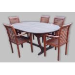 A teak extending garden table together with a set of five garden chairs