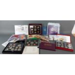 A collection of commemorative coinage in packs to include a silver proof Commonwealth Games and many
