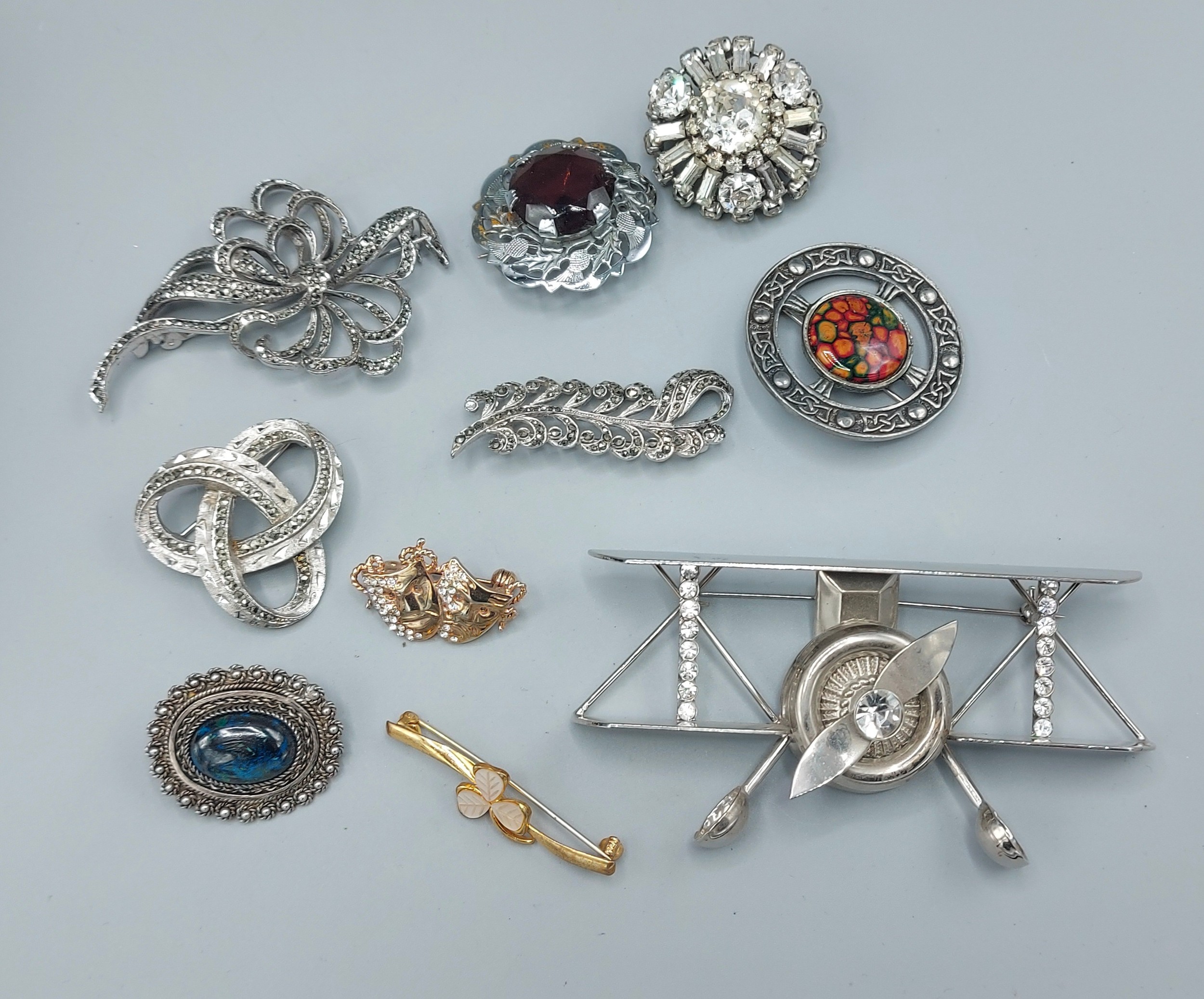 A collection of ten brooches to include marcasite
