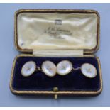 A pair of 9ct gold and Mother Of Pearl set cufflinks in fitted case, 6 grams
