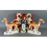 A pair of Staffordshire models of Greyhounds together with a pair of Staffordshire models of