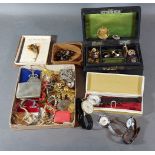 A collection of jewellery to include necklaces, brooches and four wrist watches