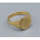 An 18ct gold signet ring bearing inscription, 8.1 grams