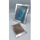 A Birmingham silver rectangular photograph frame, 25.5cms x 19.5cms together with a Chester silver