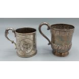 A Victorian silver christening mug of half lobed form, London 1880 together with another similar