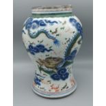 A Chinese vase, decorated with serpents amongst foliage in coloured enamels, six character mark to