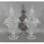 A pair of glass covered bon bon comports with cut glass stems, 30cms tall